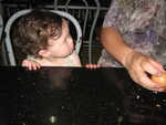 Haley watching Albert eat an egg