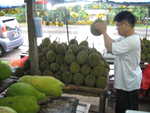 Shaking a durian to check if the fruit is soft is apparently a standard technique. The trick is to hold it without getting impaled.